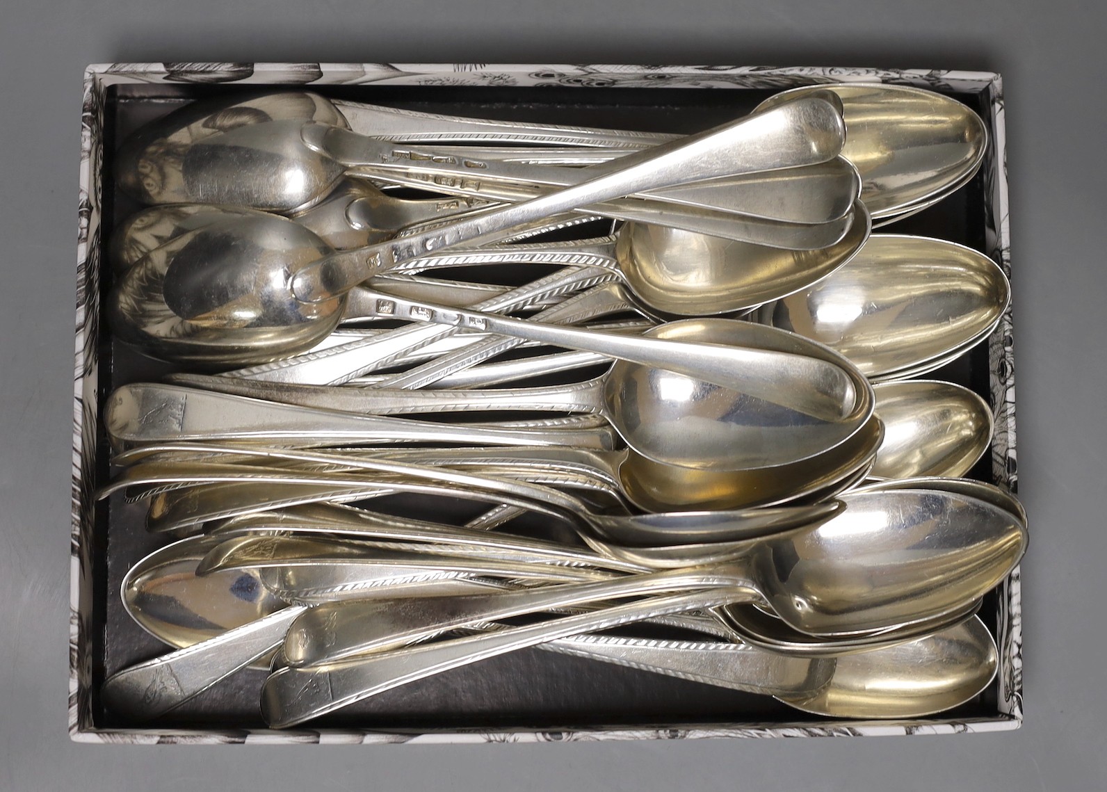 A matched harlequin set of thirty five late 18th/early 19th century silver Old English feather edge pattern table spoons, various dates and makers